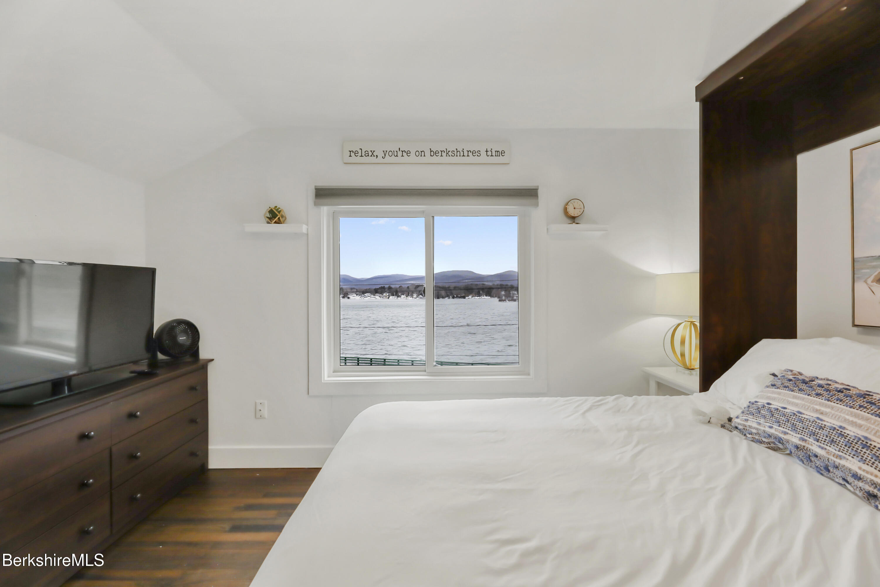 1526 North Street Pittsfield, MA 01201 - Photo 15 of 20 a bedroom with a bed and a flat tv screen on dresser