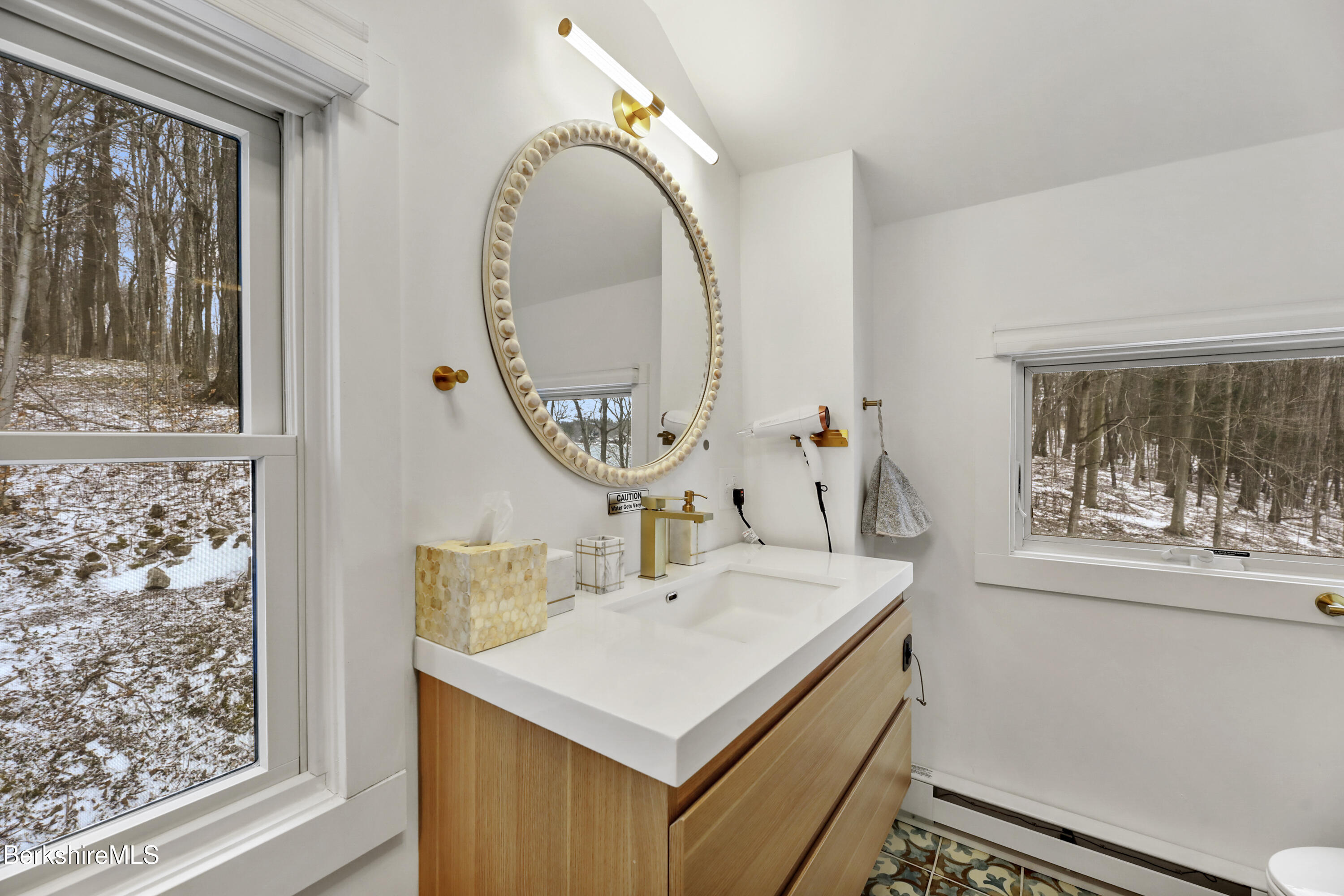 1526 North Street Pittsfield, MA 01201 - Photo 18 of 20 a bathroom with a sink a mirror and a window