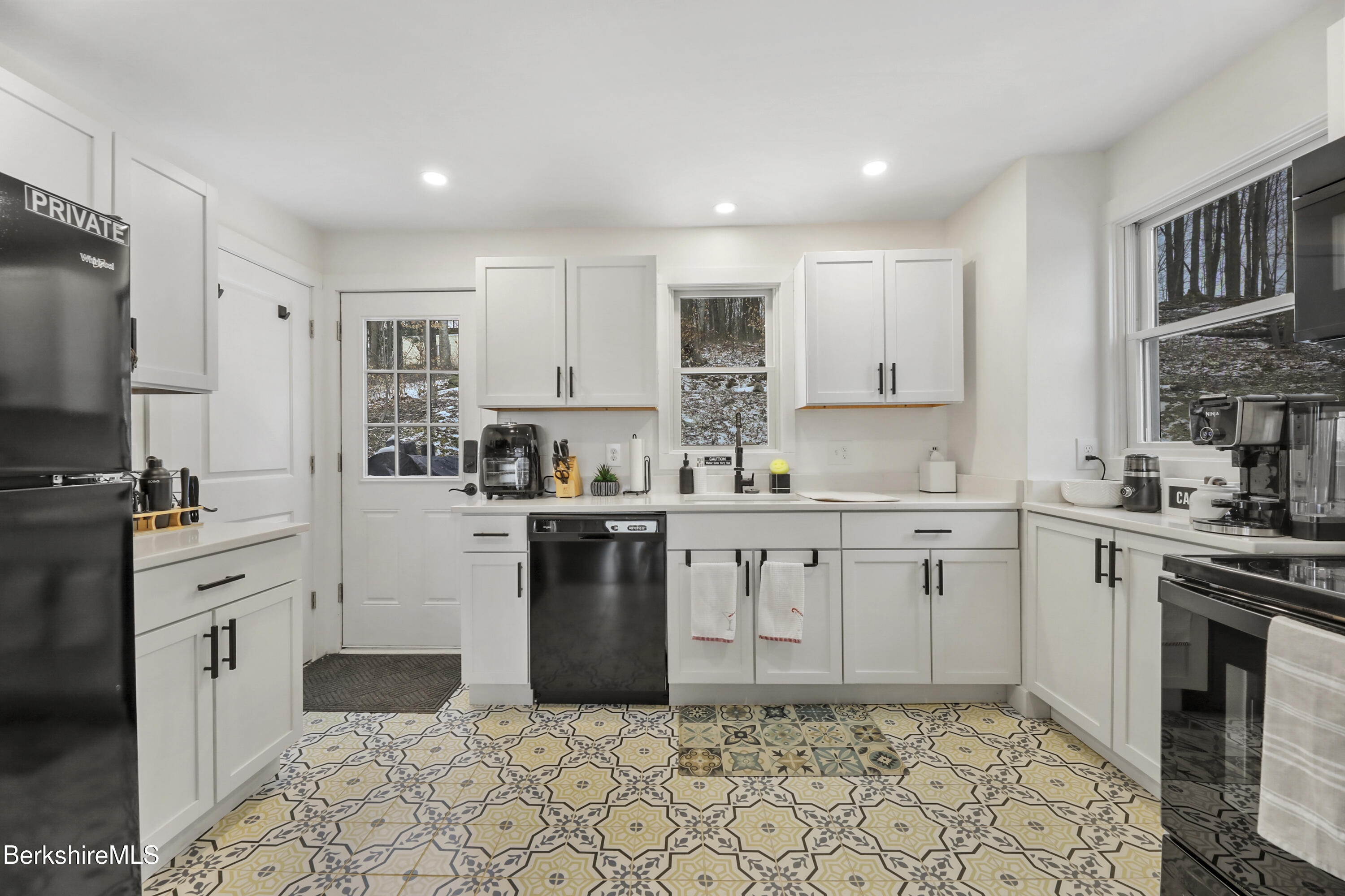 1526 North Street Pittsfield, MA 01201 - Photo 8 of 20 a kitchen with granite countertop a sink stove and refrigerator