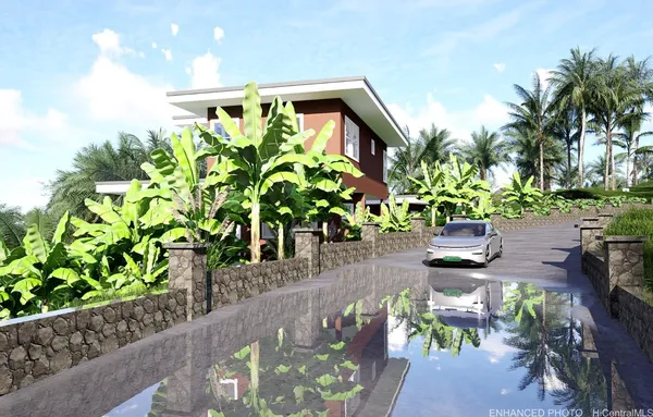 a backyard of a house with a table and chairs