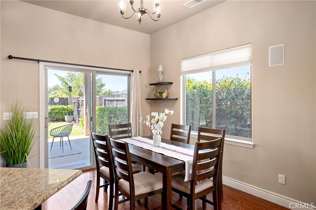 2775 Levi Lane Chico, CA 95973 - Photo 13 of 34 a view of a dining room with furniture window and wooden floor