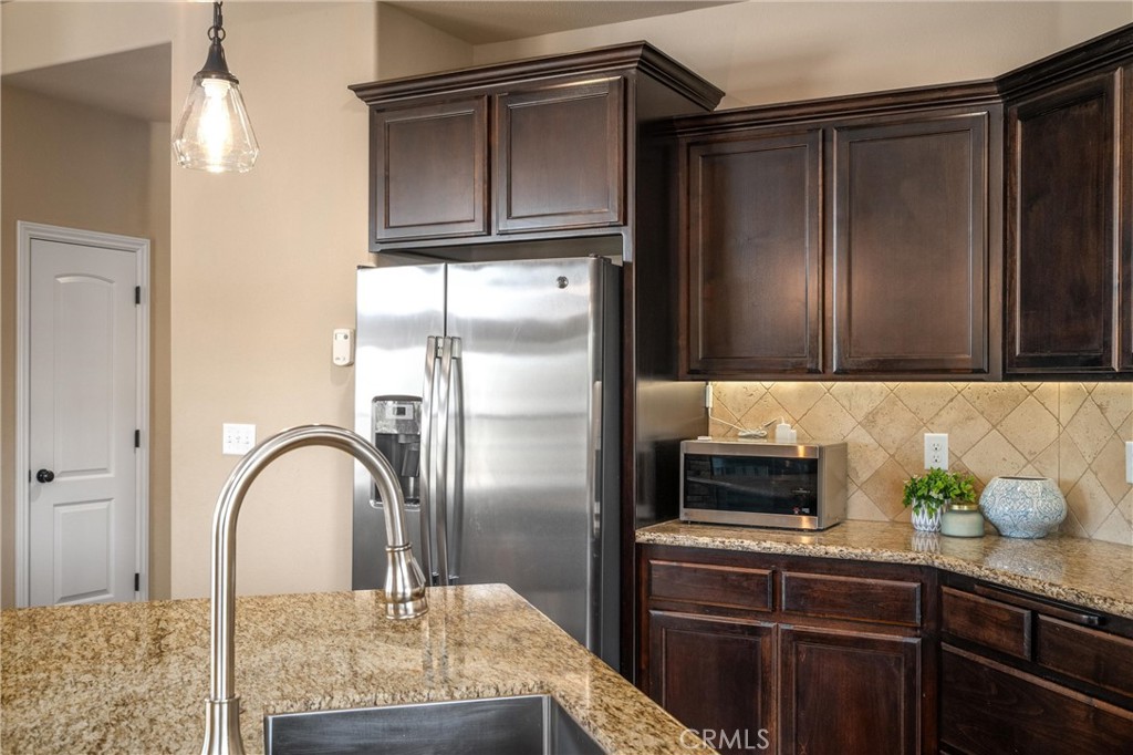 2775 Levi Lane Chico, CA 95973 - Photo 16 of 34 a kitchen with stainless steel appliances granite countertop a refrigerator and a stove top oven