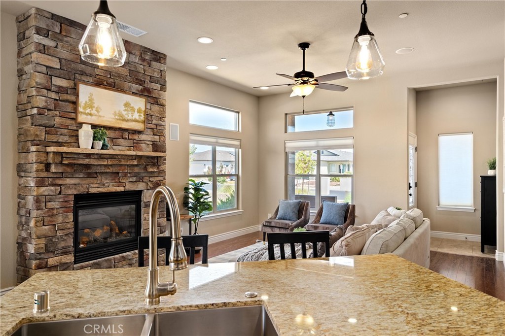 2775 Levi Lane Chico, CA 95973 - Photo 17 of 34 a living room with furniture a fireplace and a chandelier