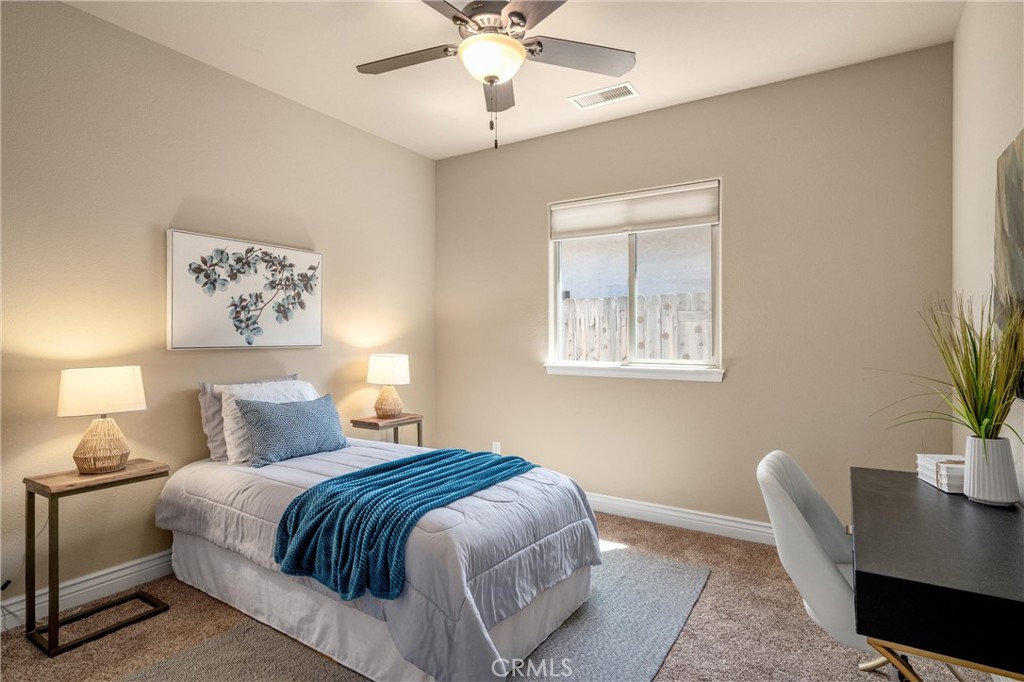 2775 Levi Lane Chico, CA 95973 - Photo 19 of 34 a bedroom with a large bed and a potted plant