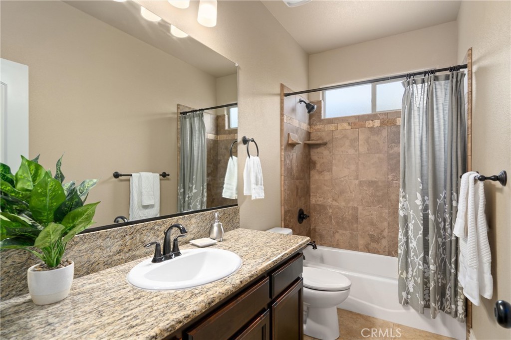 2775 Levi Lane Chico, CA 95973 - Photo 20 of 34 a bathroom with a granite countertop sink toilet and shower