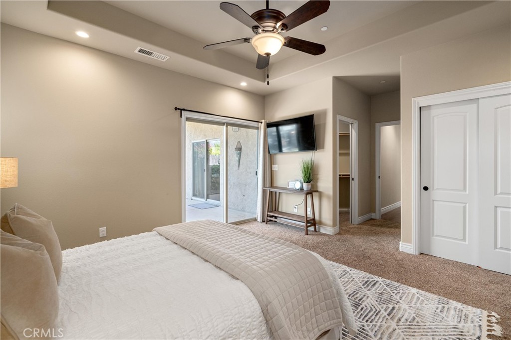 2775 Levi Lane Chico, CA 95973 - Photo 23 of 34 a bedroom with a bed and a chandelier