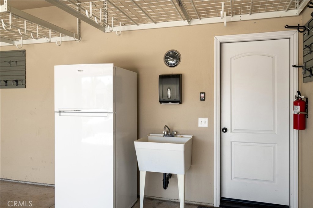 2775 Levi Lane Chico, CA 95973 - Photo 28 of 34 a bathroom with a sink and a refrigerator