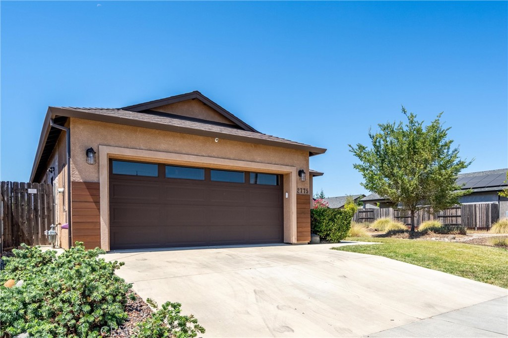 2775 Levi Lane Chico, CA 95973 - Photo 32 of 34 a front view of a house with a yard and garage
