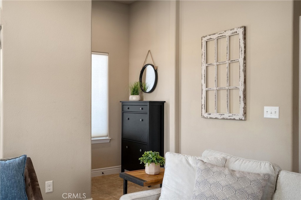 2775 Levi Lane Chico, CA 95973 - Photo 7 of 34 a room with a couch and a potted plant