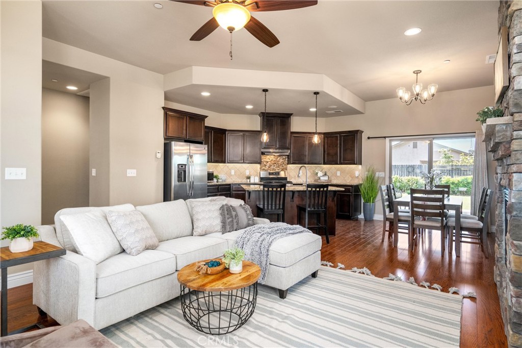 2775 Levi Lane Chico, CA 95973 - Photo 9 of 34 a living room with furniture kitchen and a chandelier
