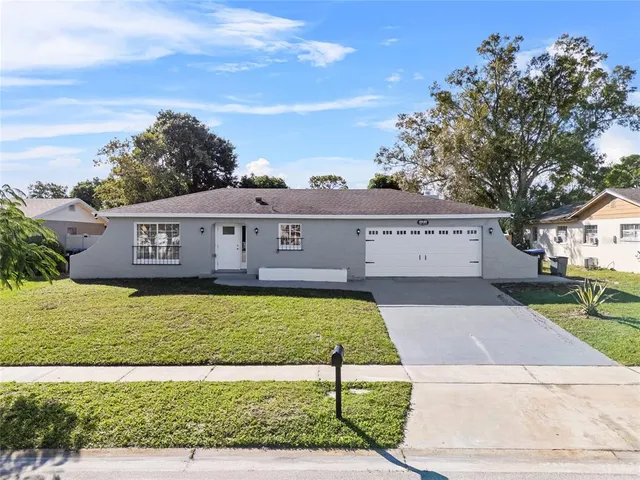 a view of a house with a yard