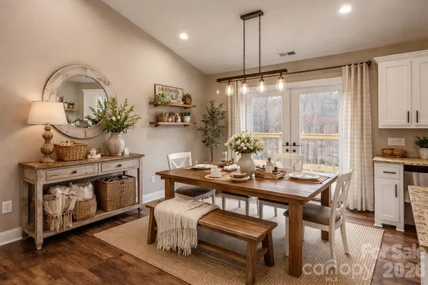 a living room with furniture a table and a fireplace