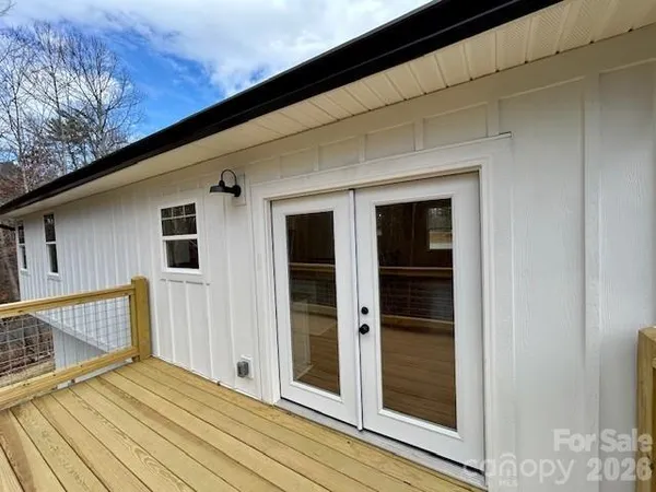 a view of balcony with wooden floor