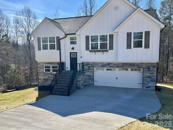 a front view of a house with yard