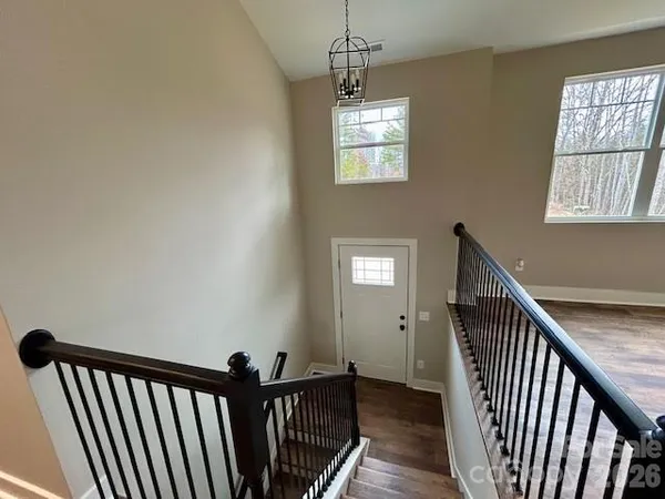 a view of a balcony with wooden floor