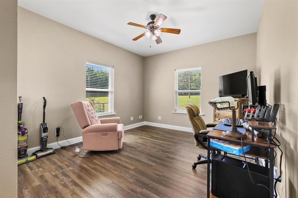 2658 Oak Ridge Road Denison, TX 75021 - Photo 21 of 37 a view of a workspace with furniture and a window
