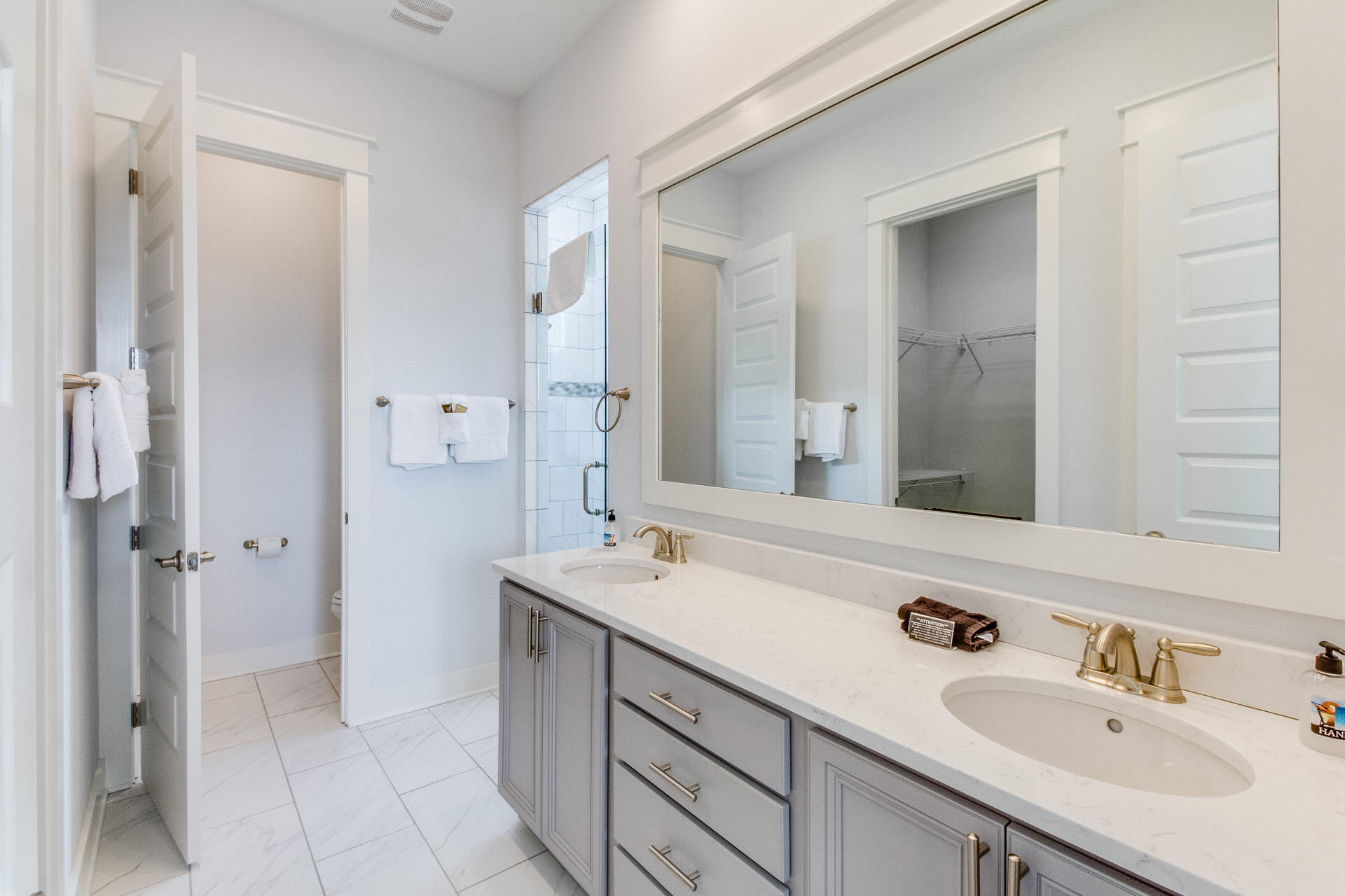 10 York Ln Inlet Beach, Unit C289 Inlet Beach, FL 32461 - Photo 13 of 32 a bathroom with a sink double vanity and a mirror