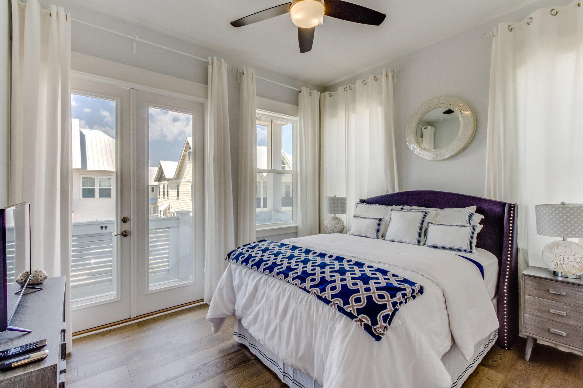 10 York Ln Inlet Beach, Unit C289 Inlet Beach, FL 32461 - Photo 17 of 32 a bedroom with a large bed and a chandelier