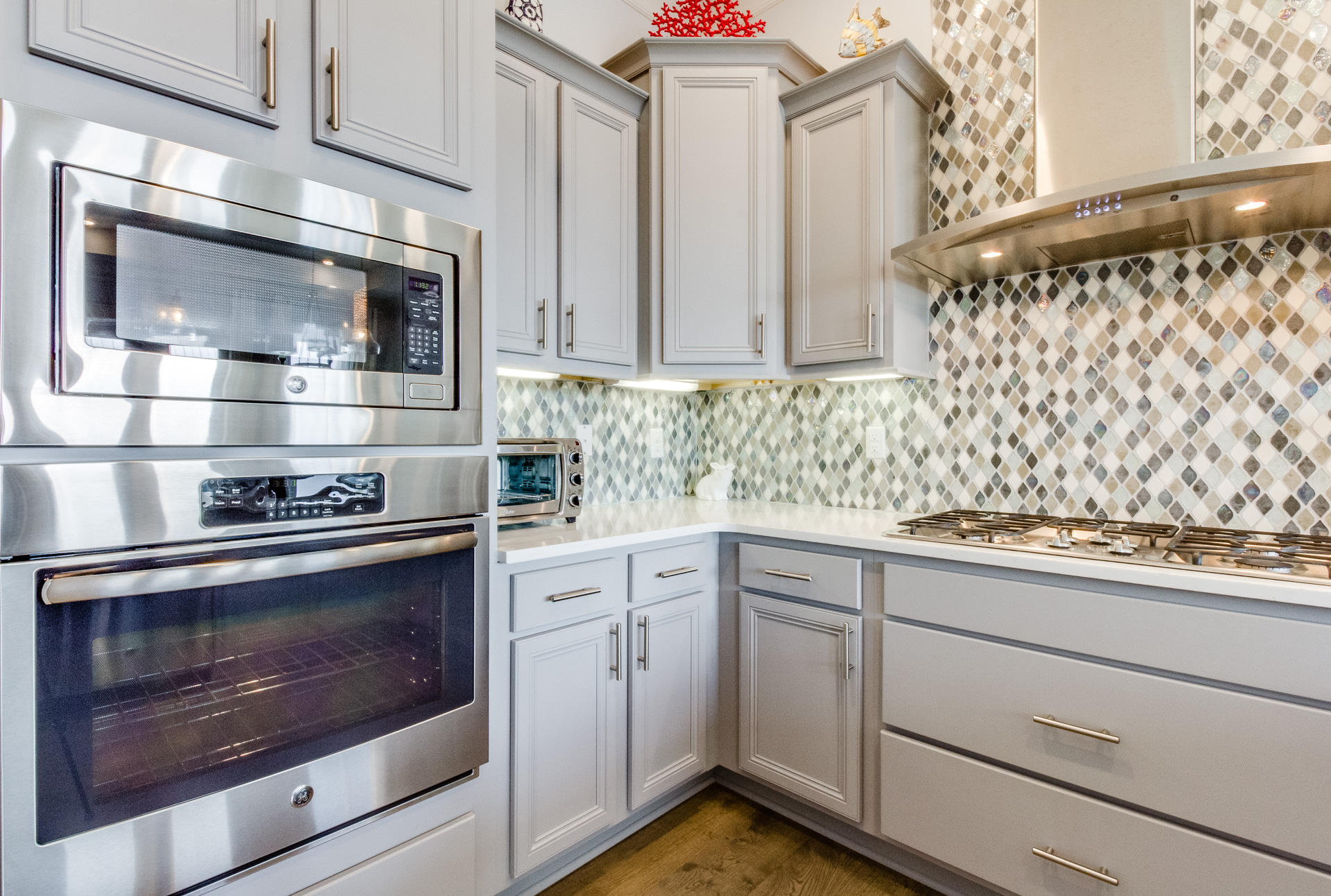10 York Ln Inlet Beach, Unit C289 Inlet Beach, FL 32461 - Photo 10 of 32 a kitchen with granite countertop white cabinets stainless steel appliances and sink