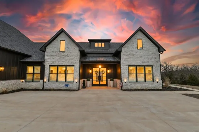 a view of a house with a street
