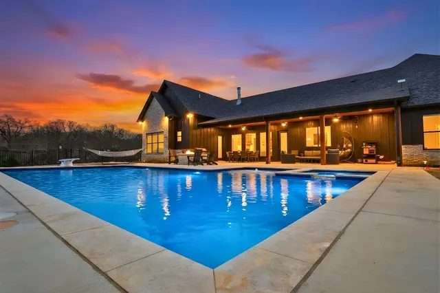 a view of swimming pool with furniture