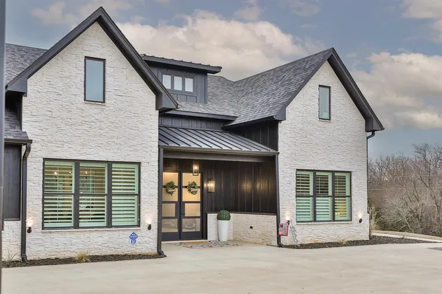 a front view of a house with a garage