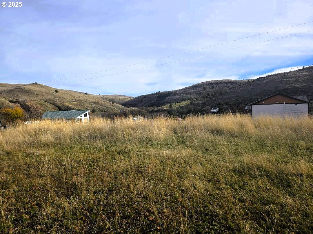 Elrod Place Maupin, OR 97037 - Photo 2 of 5 a view of a lake with houses in the back
