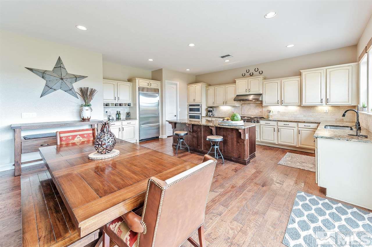 9775 Cardigan Bay Lane Reno, NV 89521 - Photo 6 of 25 a kitchen with cabinets and wooden floor