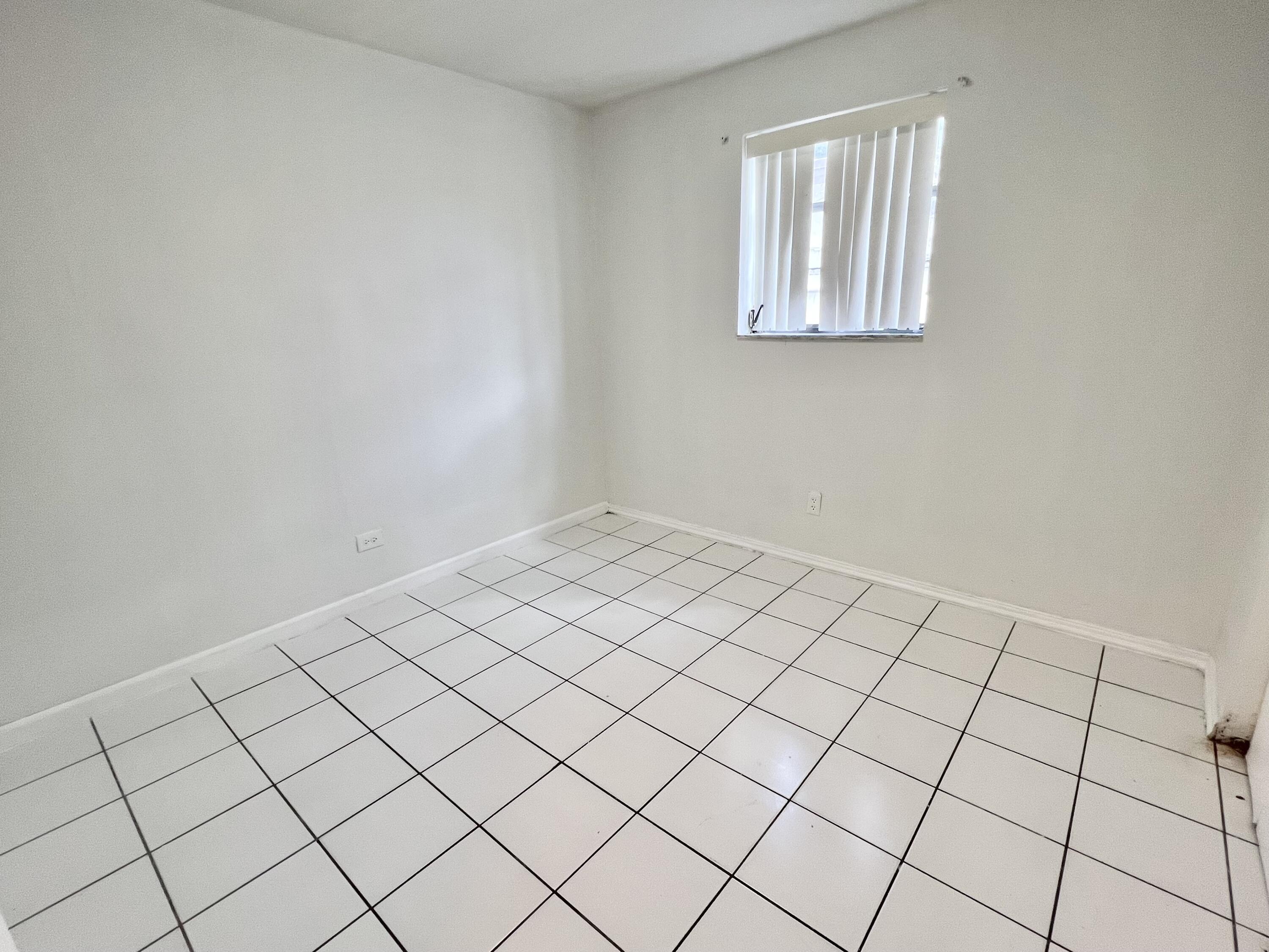 6129 Funston Street Hollywood, FL 33023 - Photo 12 of 18 a view of an empty room and window