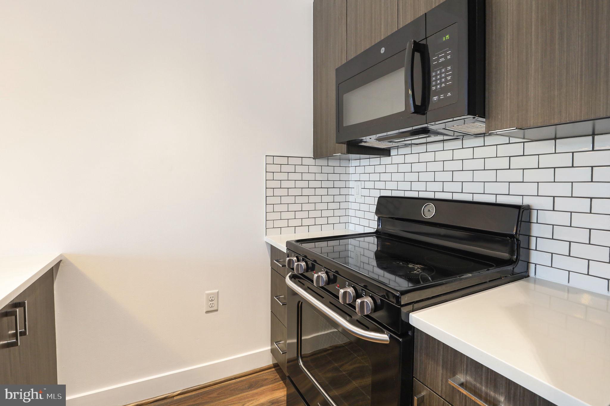 1111 Orren Street Northeast, Unit 404 Washington, DC 20002 - Photo 7 of 49 Fully equipped kitchen