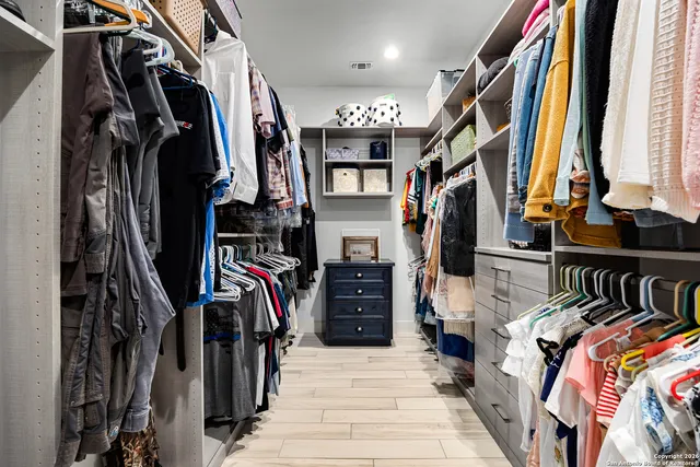 a bathroom with a sink a vanity and a mirror