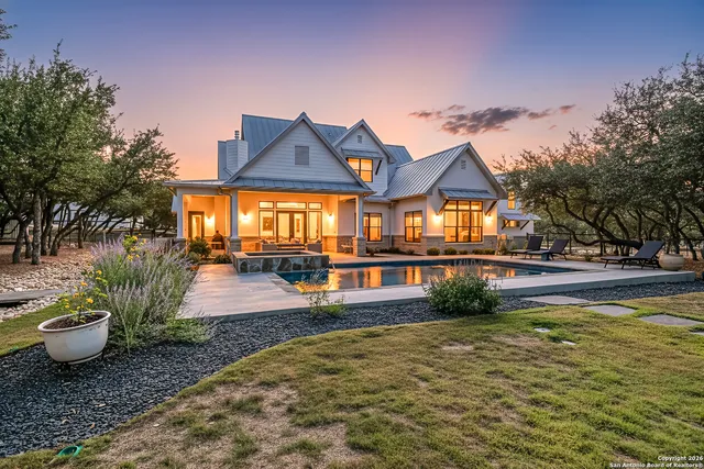 a view of a swimming pool with a yard