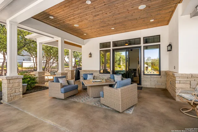 a front view of a house with swimming pool and porch