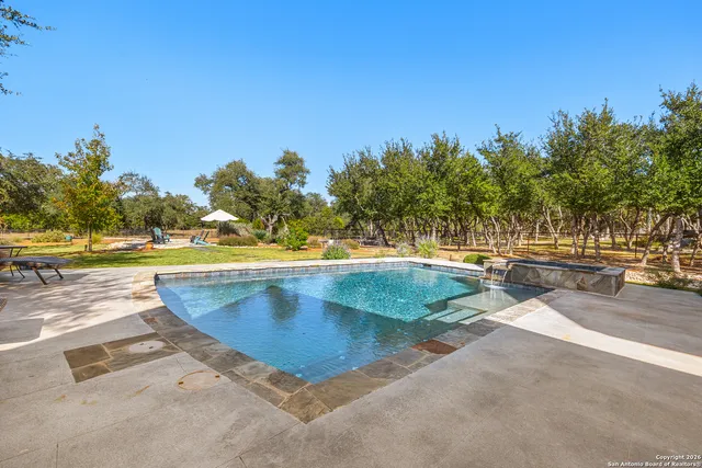 a front view of a house with swimming pool