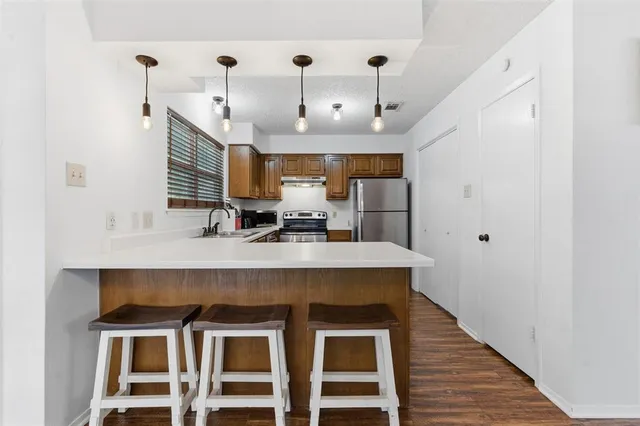 a view of a kitchen with a sink
