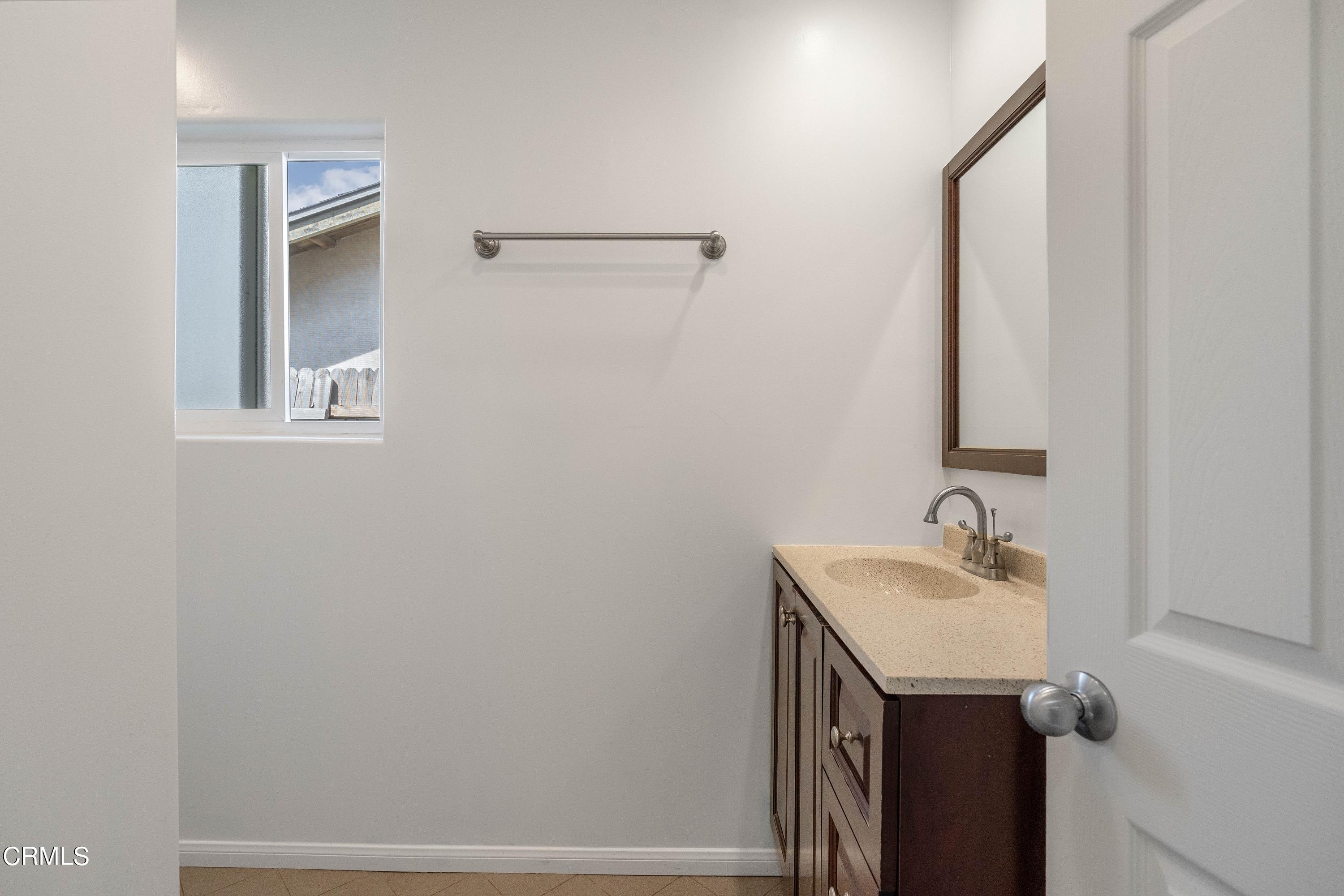 1121 Rachel Drive Oxnard, CA 93030 - Photo 12 of 21 a bathroom with a sink and a mirror