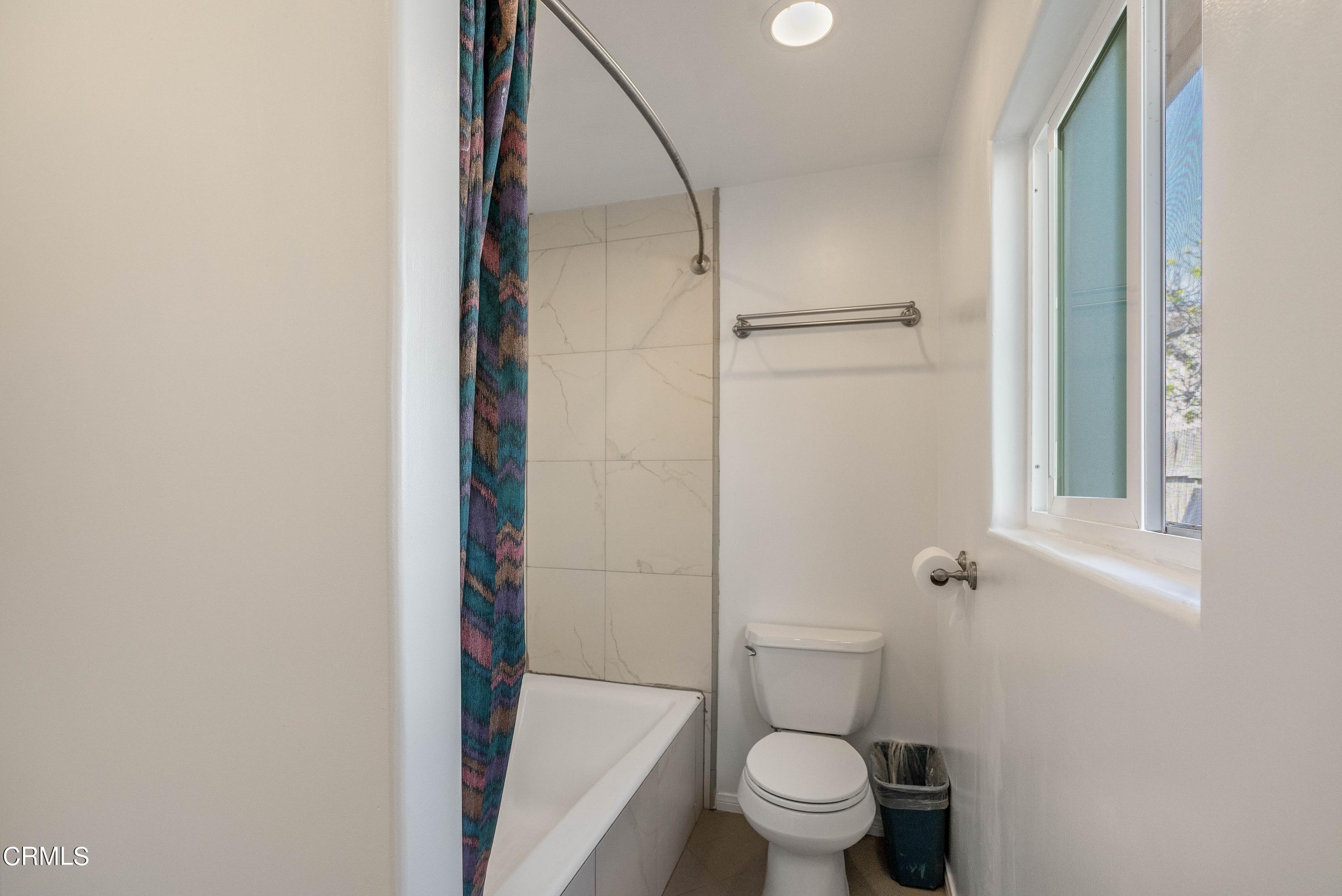 1121 Rachel Drive Oxnard, CA 93030 - Photo 13 of 21 a bathroom with a granite countertop toilet and a shower