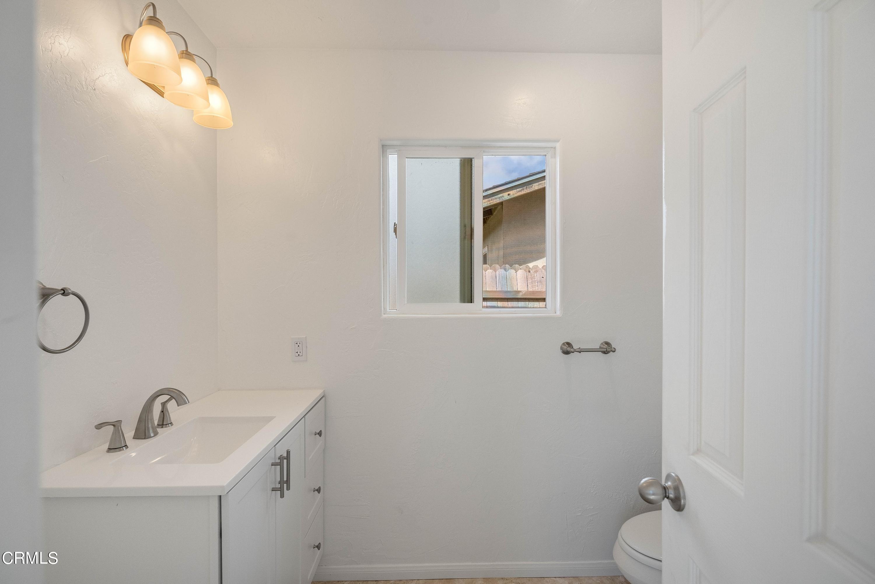 1121 Rachel Drive Oxnard, CA 93030 - Photo 14 of 21 a bathroom with a sink toilet and vanity