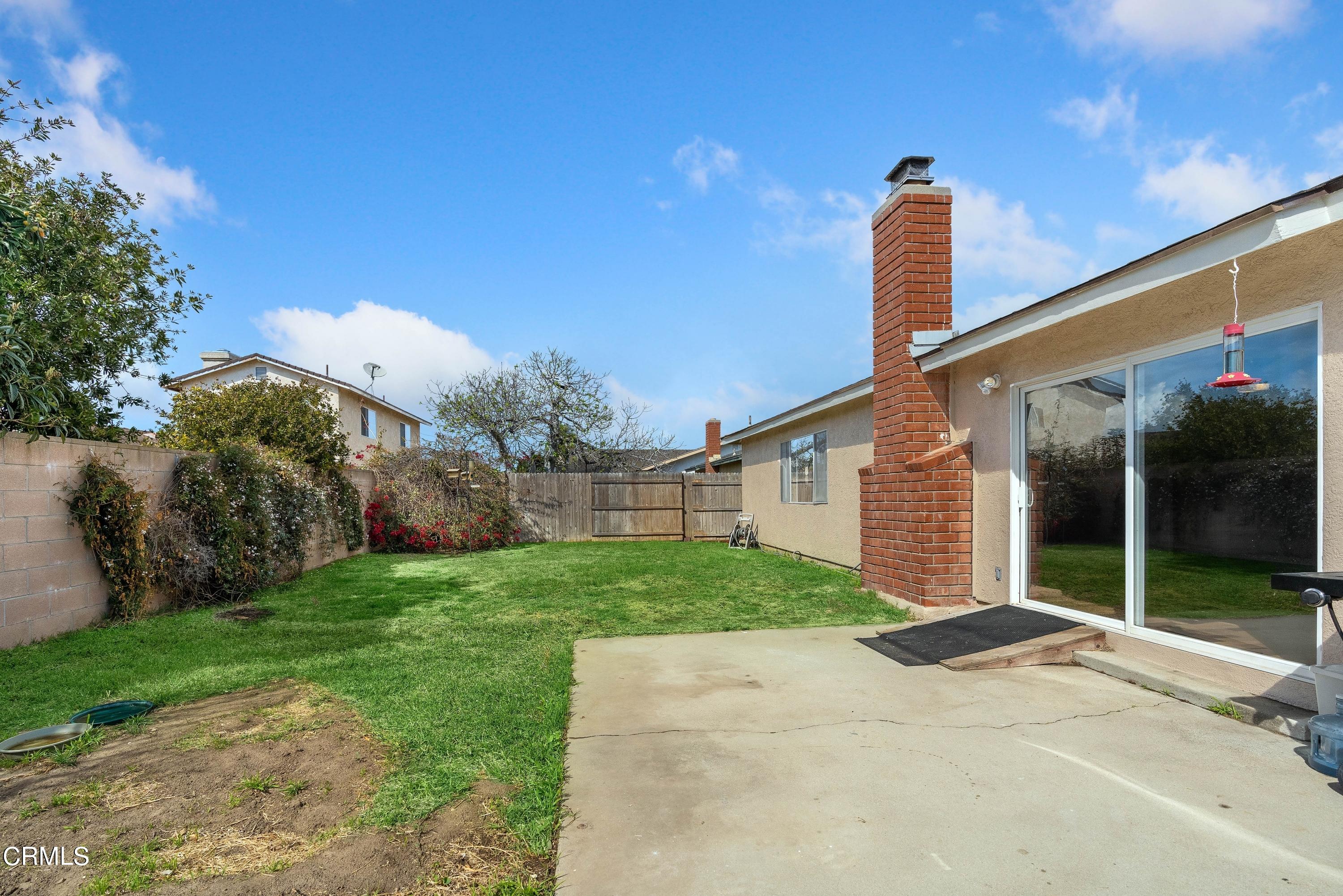 1121 Rachel Drive Oxnard, CA 93030 - Photo 18 of 21 a front view of a house with yard and outdoor space
