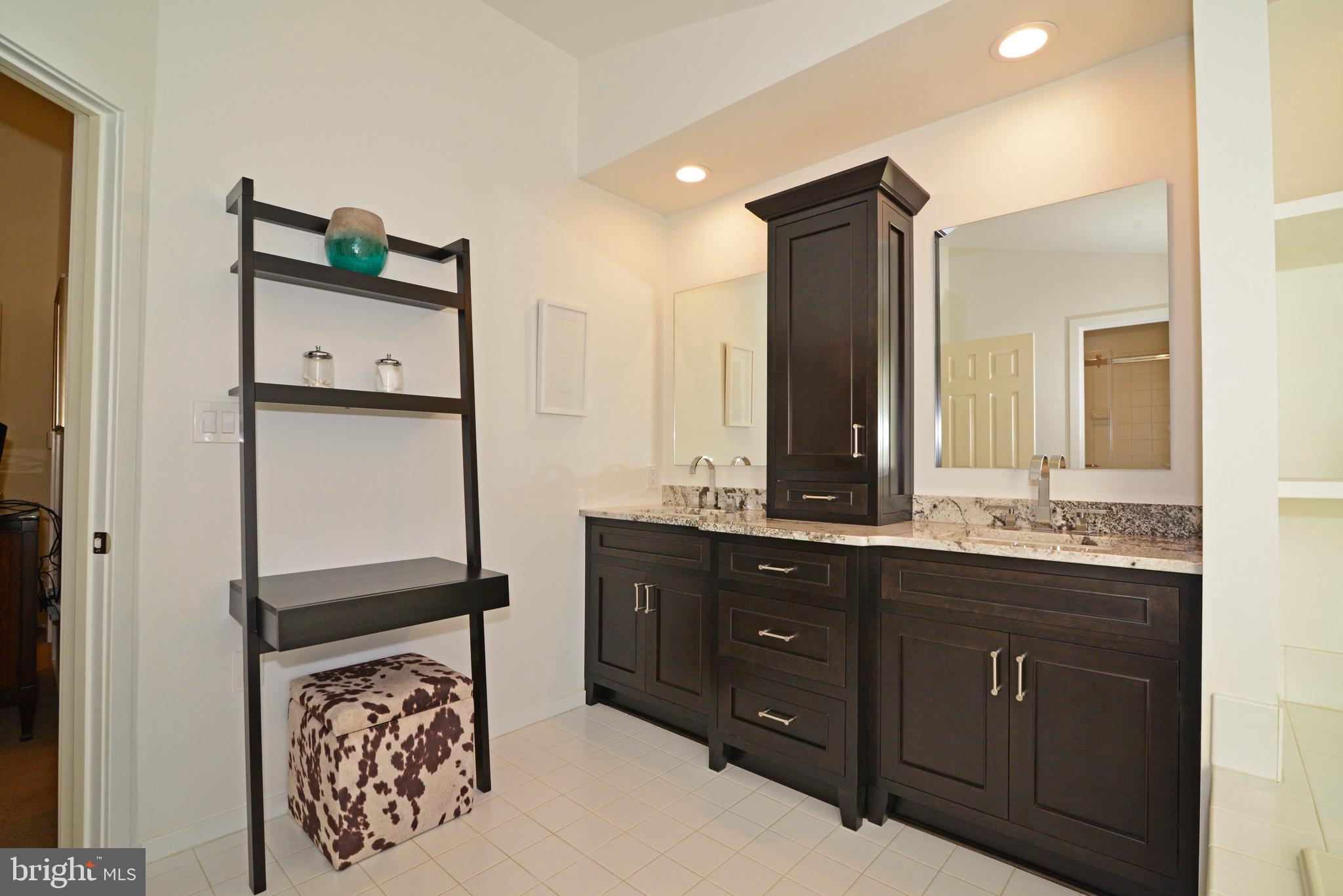 11520 Hemingway Drive Reston, VA 20194 - Photo 34 of 69 The renovated master bath has beautiful cabinetry