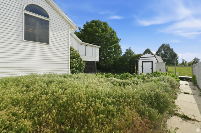 1464 990 West Provo, UT 84601 - Photo 41 of 41 White siding exterior with an arched window