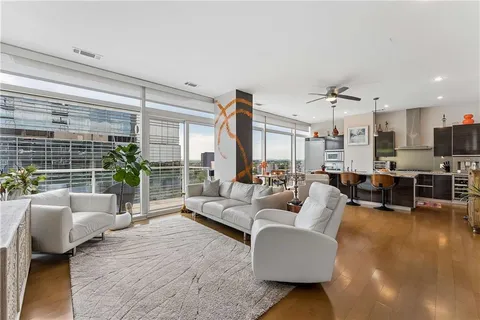 a living room with furniture and a flat screen tv