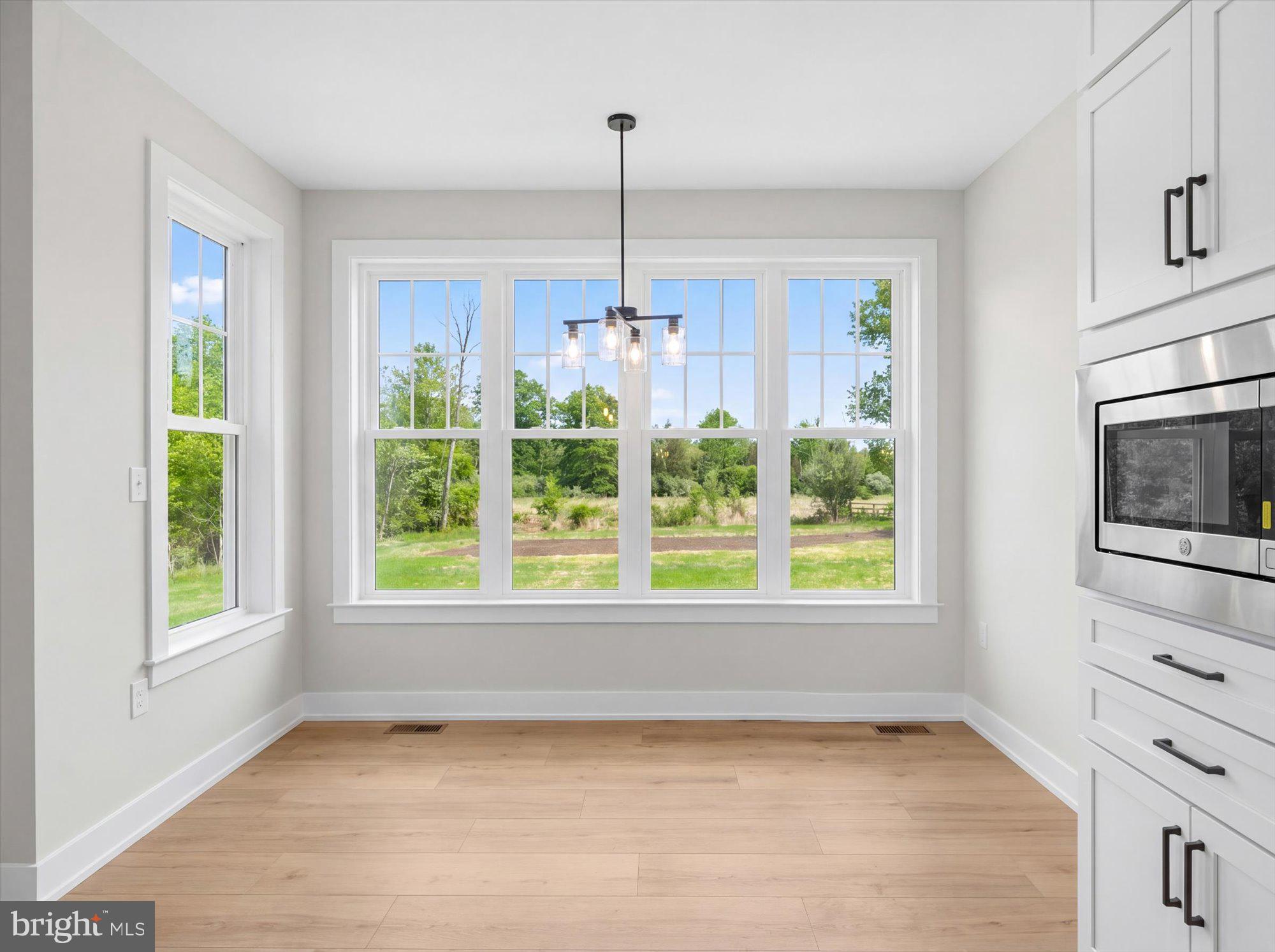 394 Renninger Road Perkiomenville, PA 18074 - Photo 18 of 41 a view of a kitchen with furniture window and wooden floor