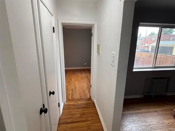 a view of a hallway with a window