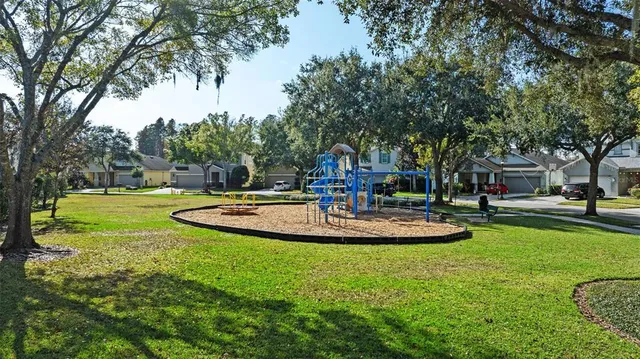 a view of a house with swimming pool and sitting area