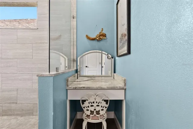 a bathroom with a sink vanity and a mirror