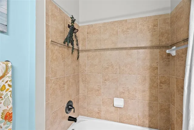 a room with a bed and a chandelier