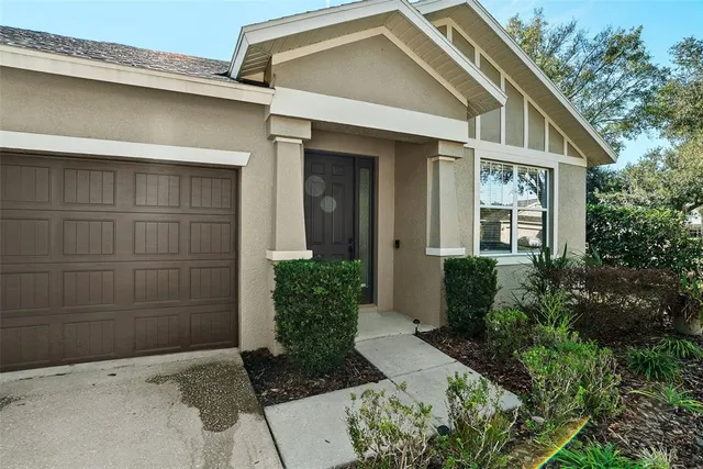 an aerial view of a swimming pool a playground and lake view