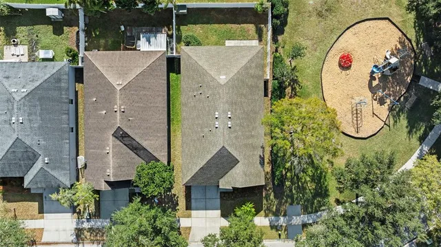 a view of a swimming pool with a yard and lake view