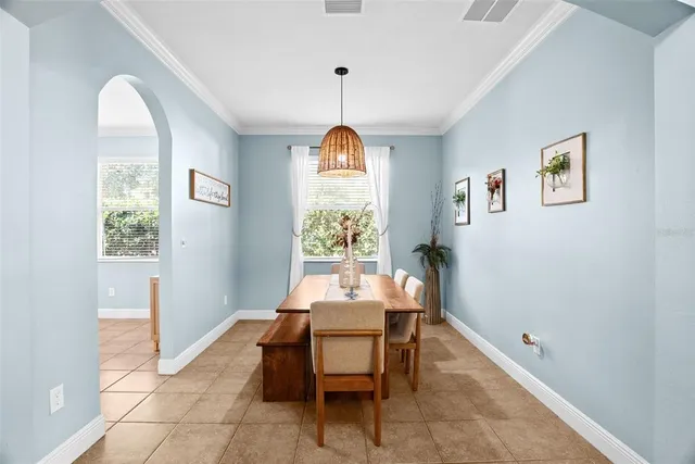a dining room with furniture and window